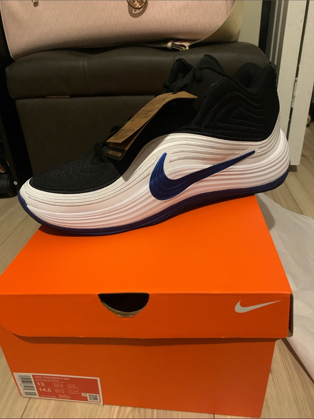 Nike Men’s Black White Athletic Shoe with Blue Swoosh